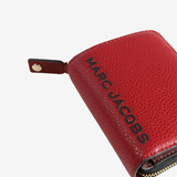 Close up of red wallet, showing texture of the split cow leather fabric