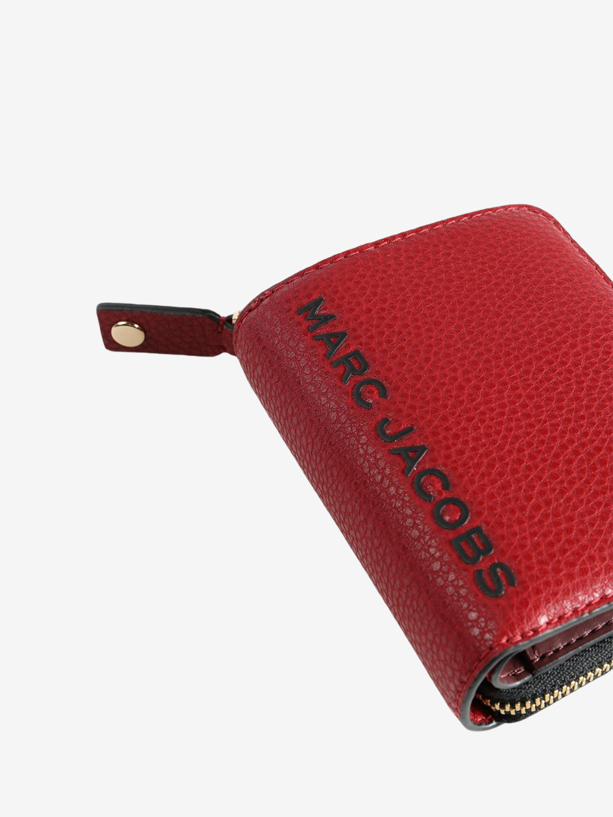 Close up of red wallet, showing texture of the split cow leather fabric