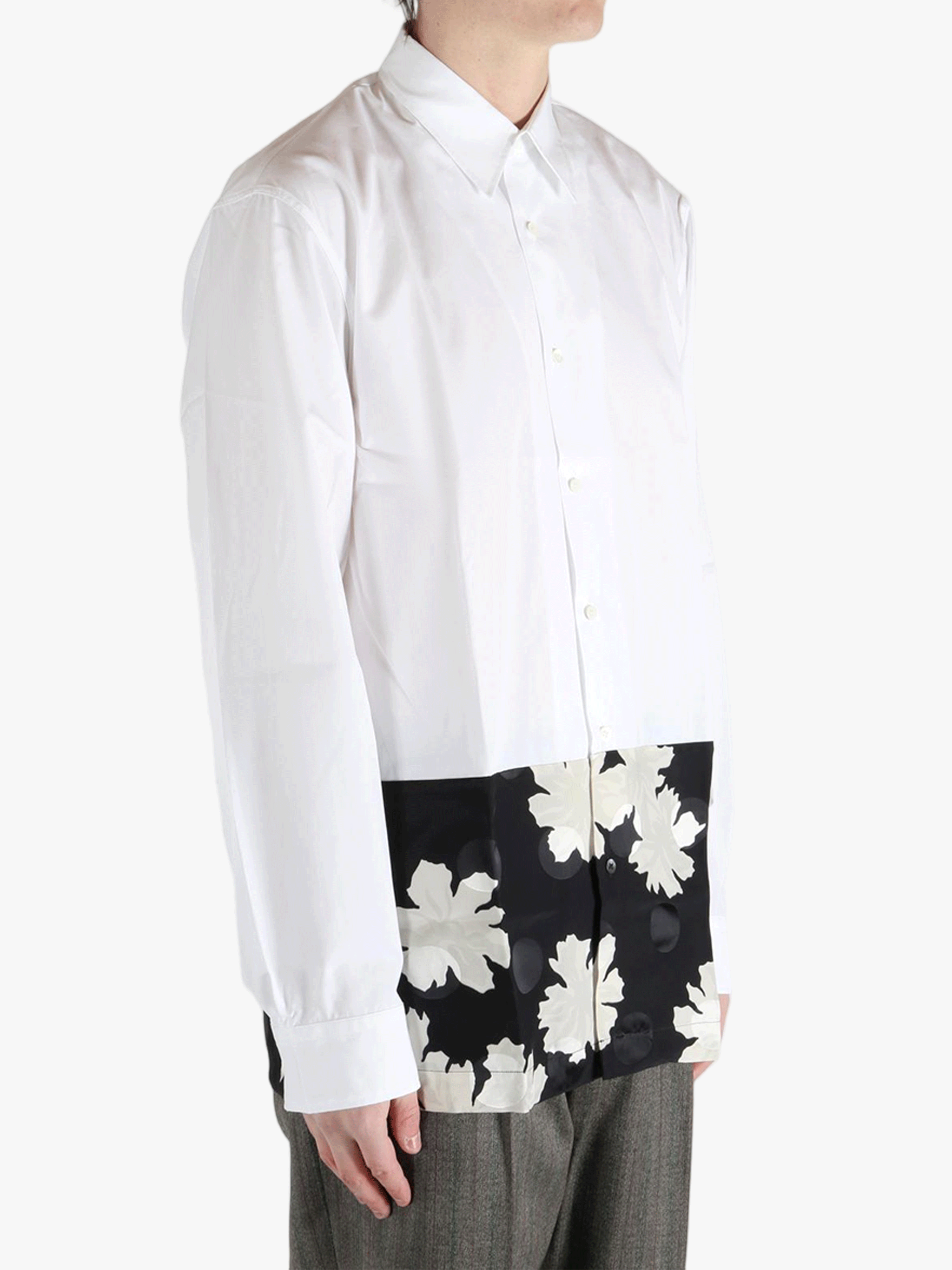 White shirt worn by a person, showing the shirt'fit