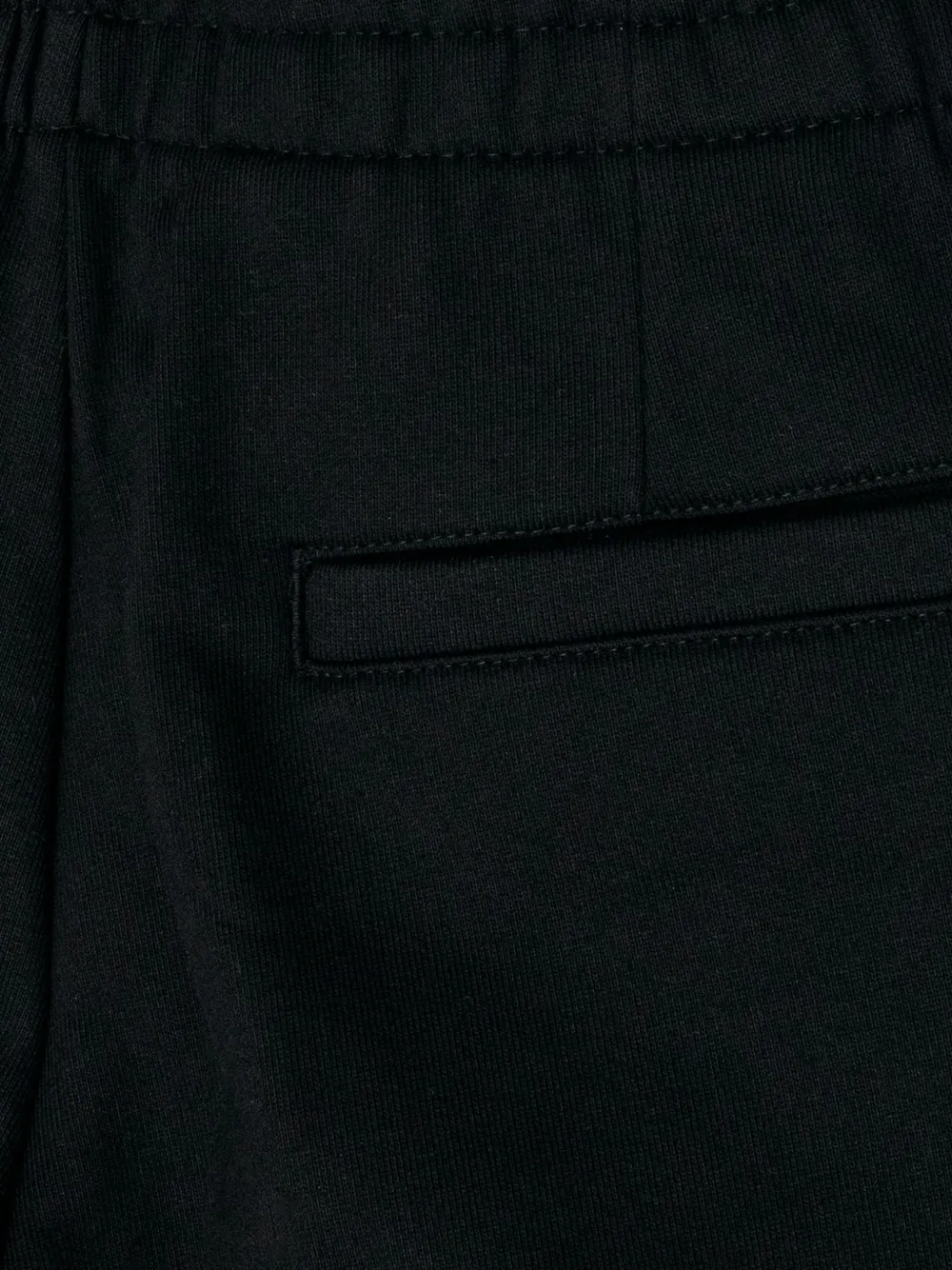 Close up of black pant, showing texture of the Cotton fabric