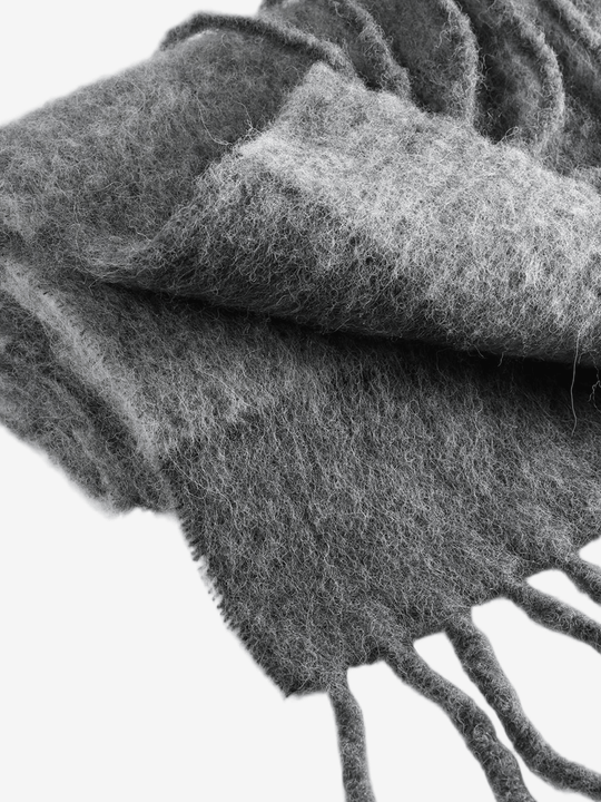 Close up of the grey scarf, showing texture of the alpaca fabric