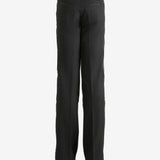 Black trouser worn by a person, showing the trouser's fit