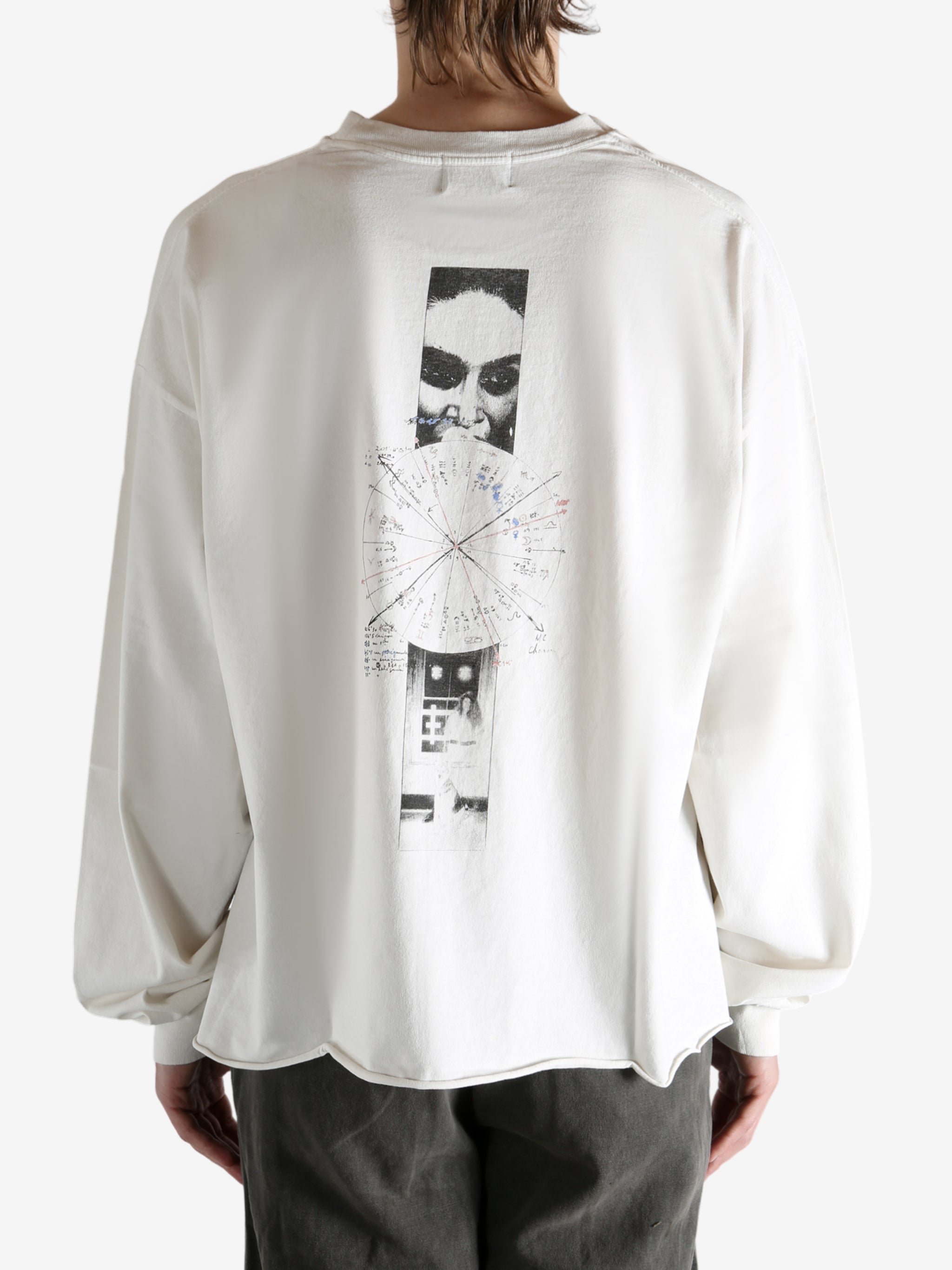 White t-shirt worn by a person, showing the t-shirt's fit