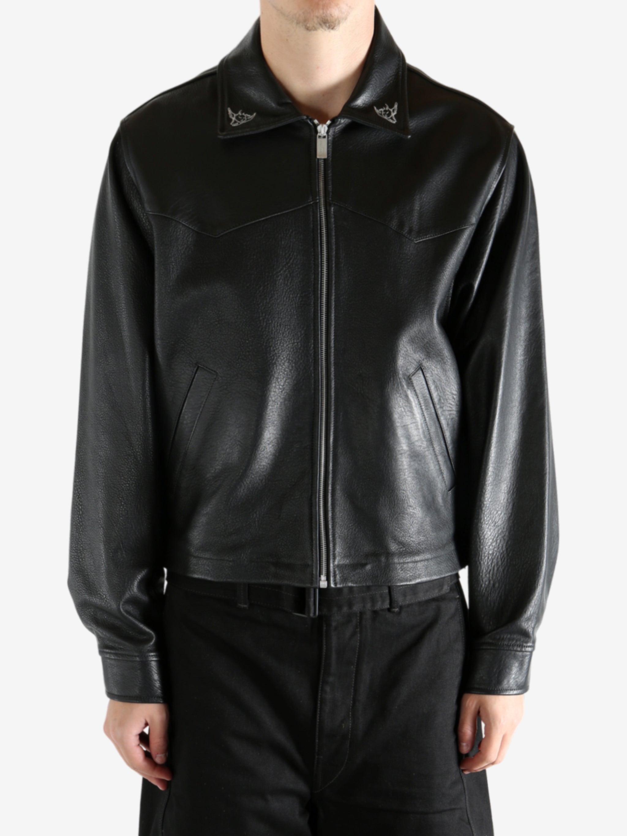 Black jacket worn by a person, showing the jacket's fit