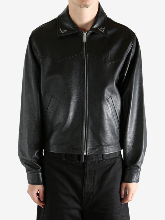 Black jacket worn by a person, showing the jacket's fit