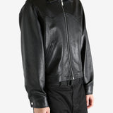 Black jacket worn by a person, showing the jacket's fit