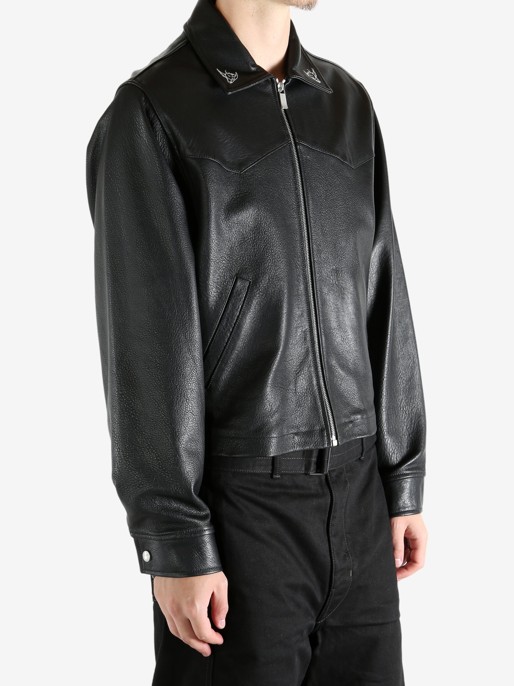 Black jacket worn by a person, showing the jacket's fit