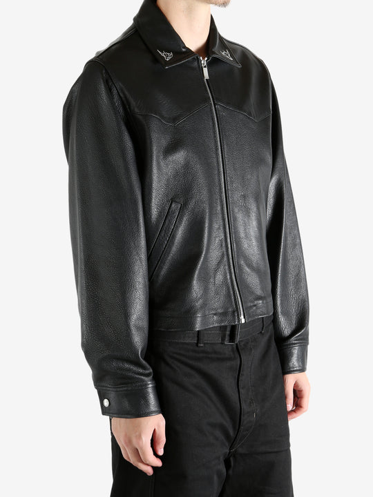 Black jacket worn by a person, showing the jacket's fit