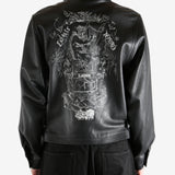 Black jacket worn by a person, showing the jacket's fit