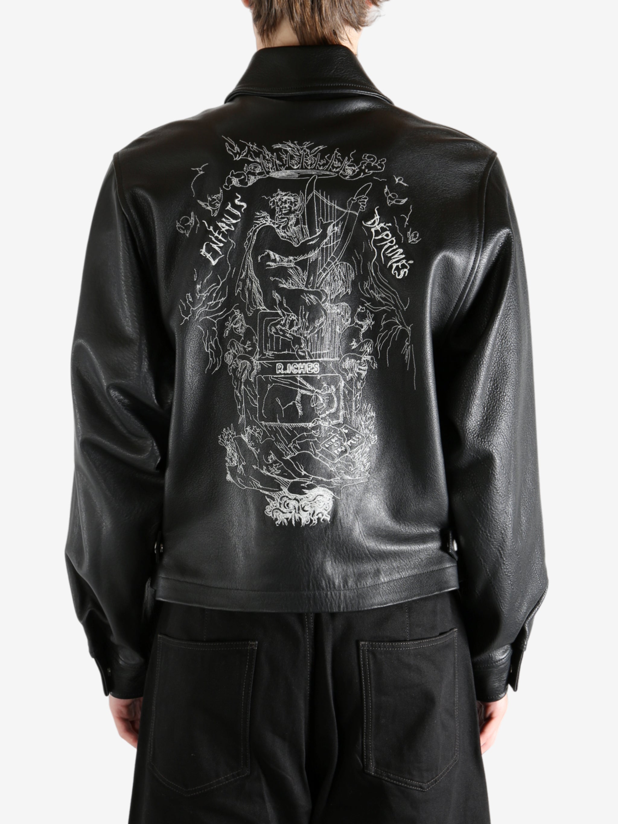 Black jacket worn by a person, showing the jacket's fit