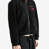 Black jackets worn by a person, showing the jackets fit