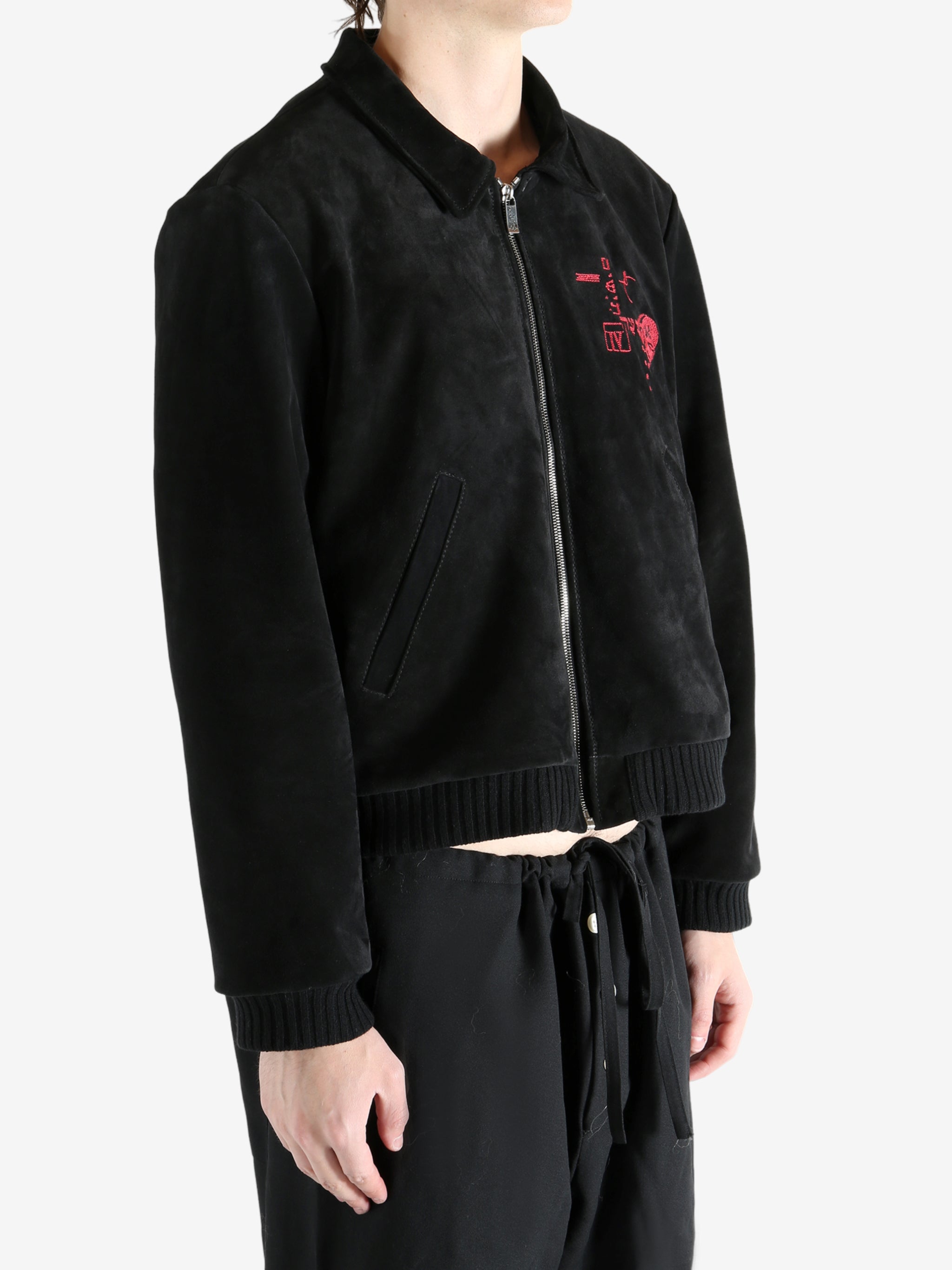 Black jackets worn by a person, showing the jackets fit