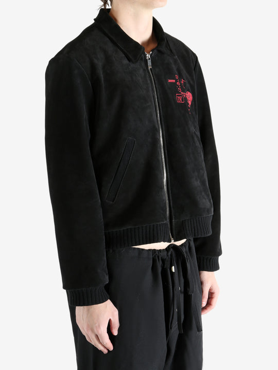 Black jackets worn by a person, showing the jackets fit