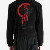 Black jackets worn by a person, showing the jackets fit