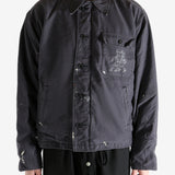 Black jacket worn by a person, showing the jacket's fit