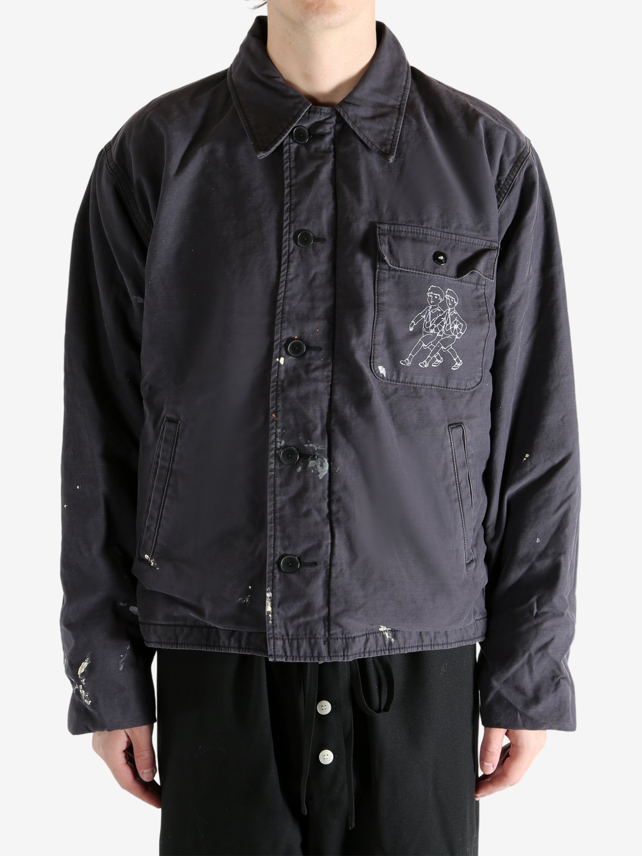 Black jacket worn by a person, showing the jacket's fit