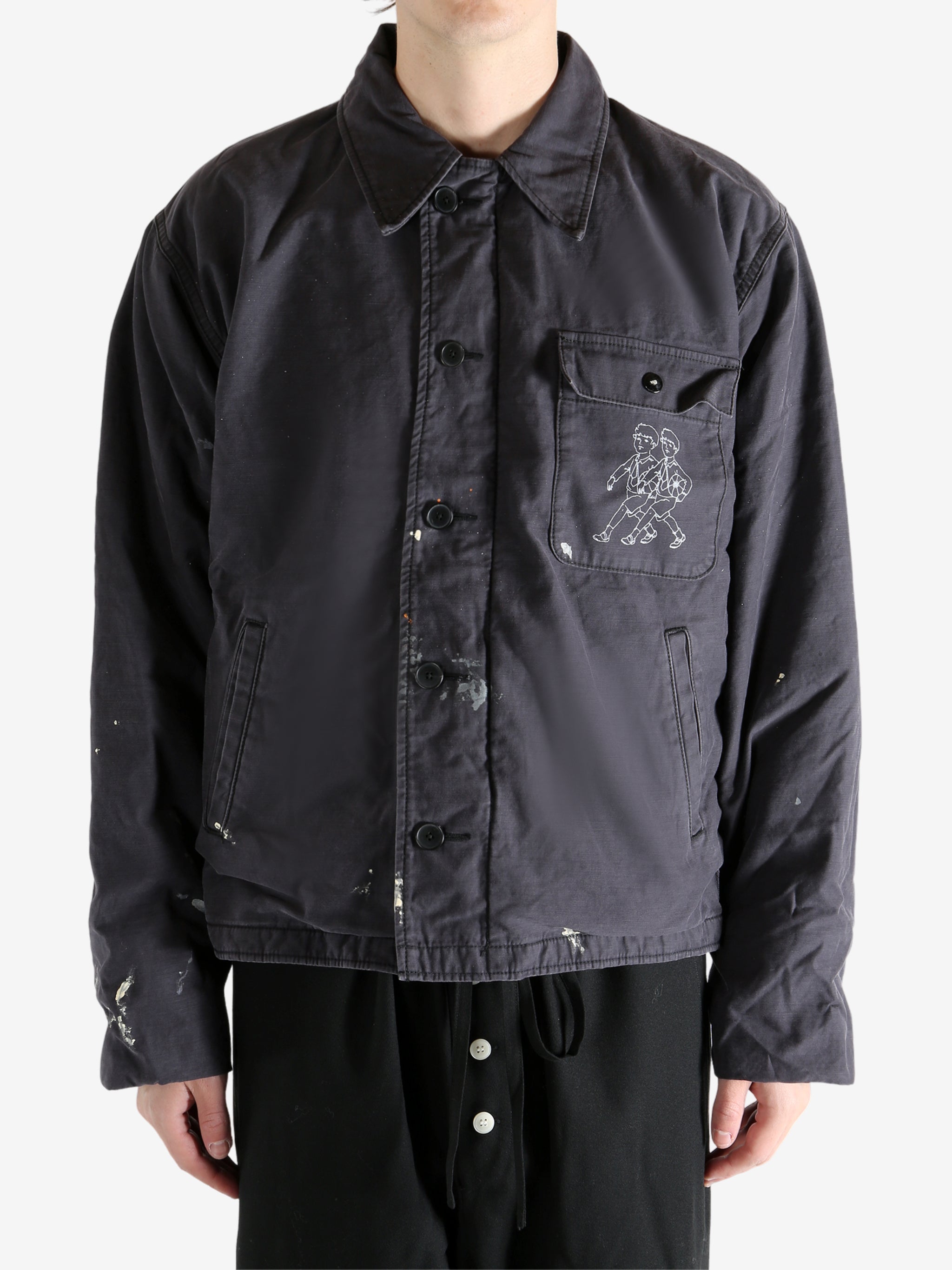 Black jacket worn by a person, showing the jacket's fit