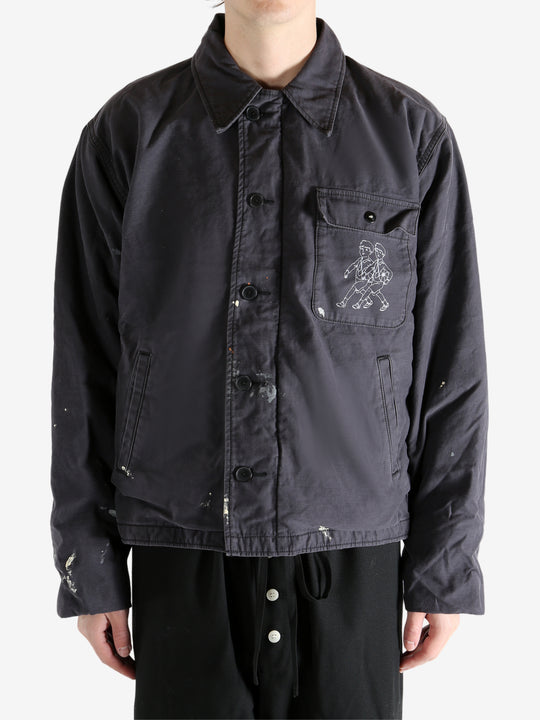 Black jacket worn by a person, showing the jacket's fit