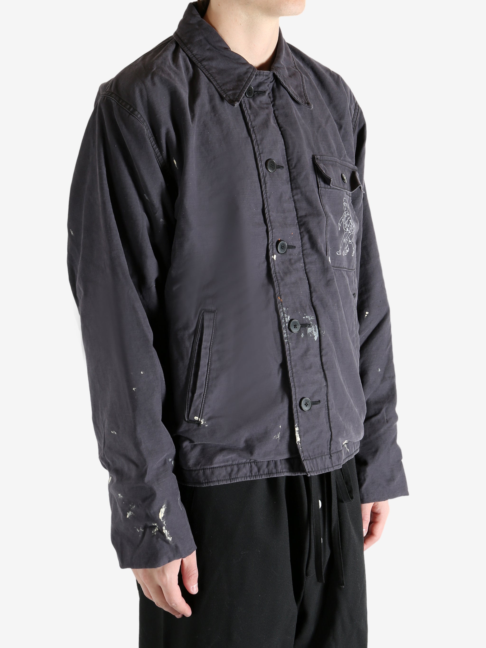 Black jacket worn by a person, showing the jacket's fit