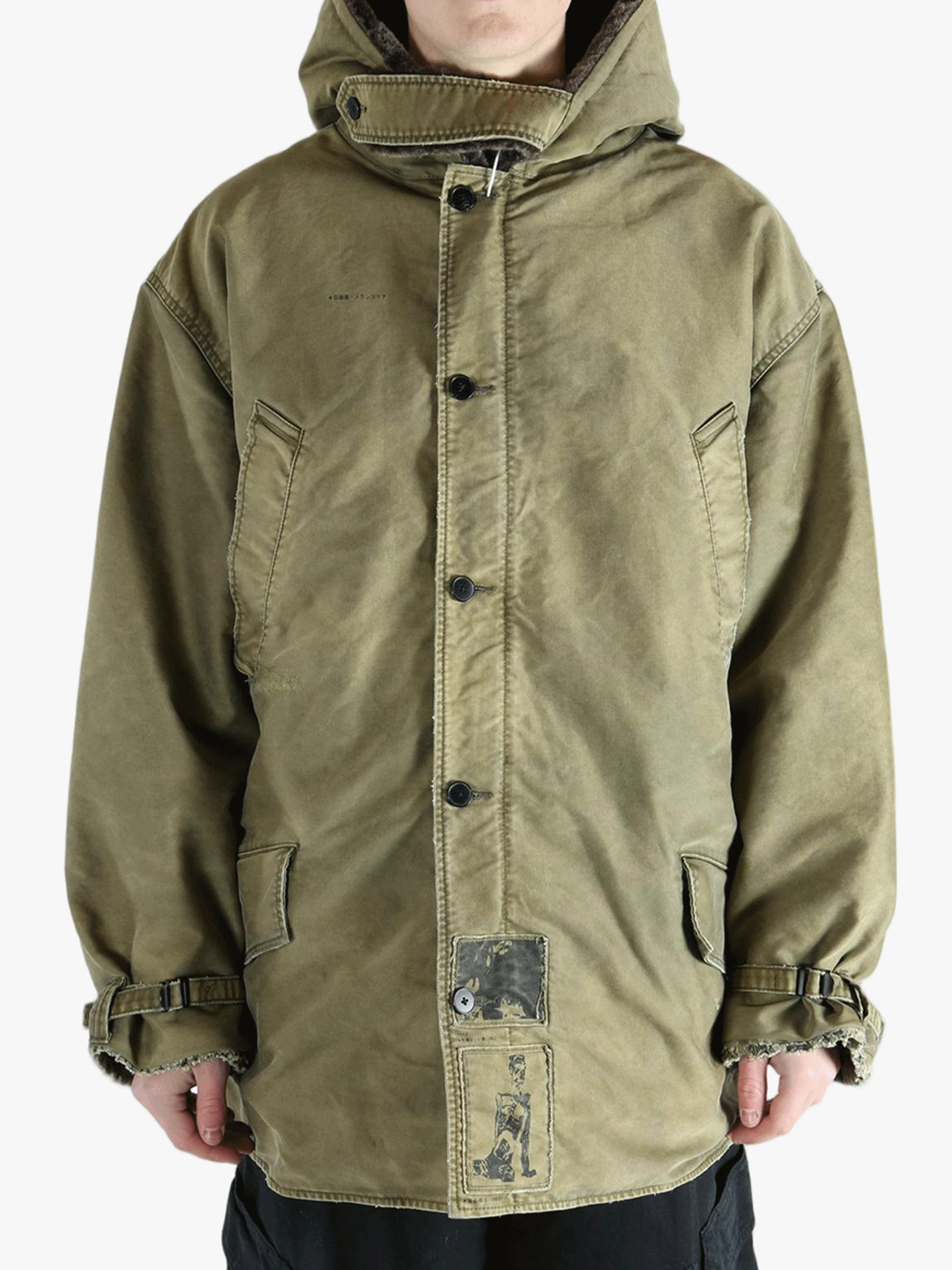 Green jackets-coats worn by a person, showing the cotton fit
