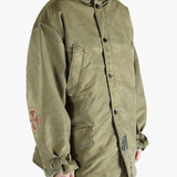 Green jackets-coats worn by a person, showing the cotton fit
