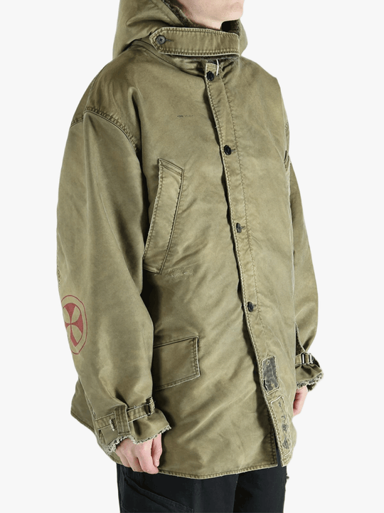 Green jackets-coats worn by a person, showing the cotton fit
