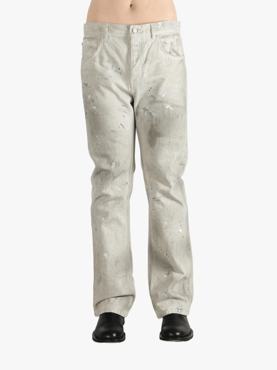 White pants worn by a person, showing the pants fit