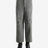 Grey pants worn by a person, showing the pants's fit