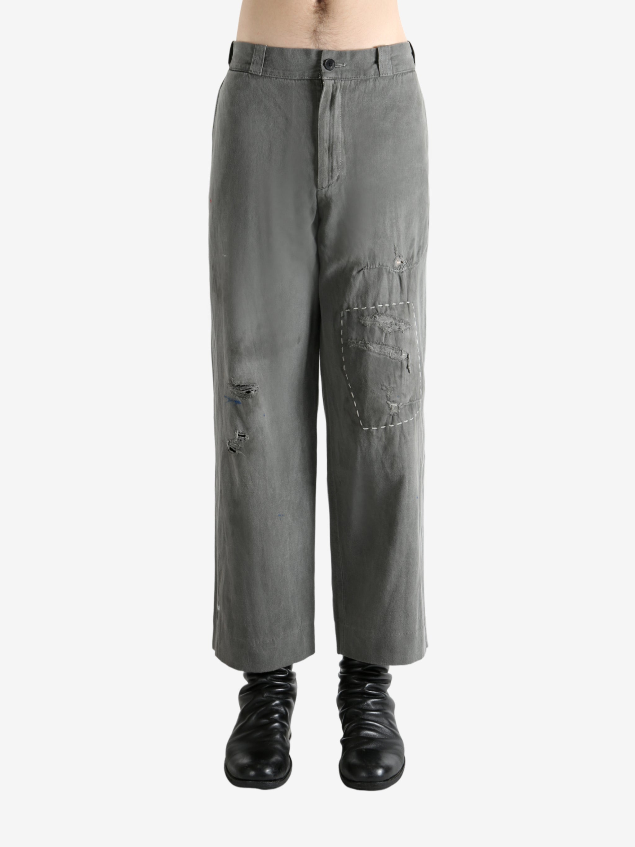 Grey pants worn by a person, showing the pants's fit