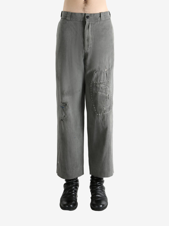 Grey pants worn by a person, showing the pants's fit