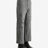 Grey pants worn by a person, showing the pants's fit