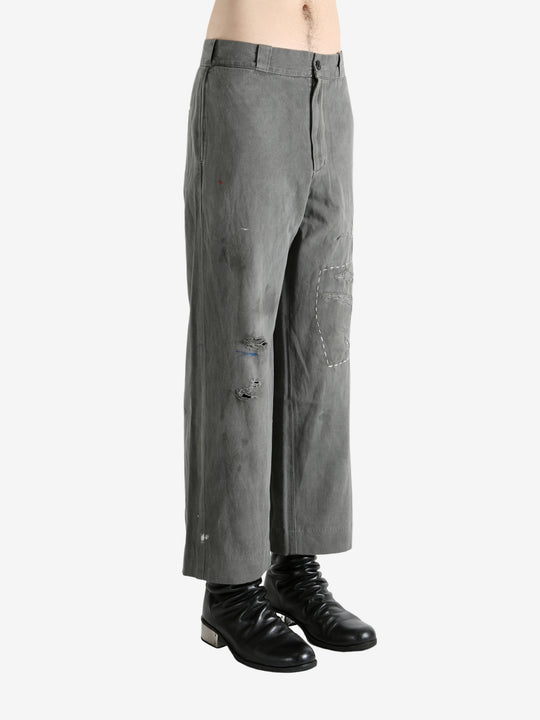 Grey pants worn by a person, showing the pants's fit