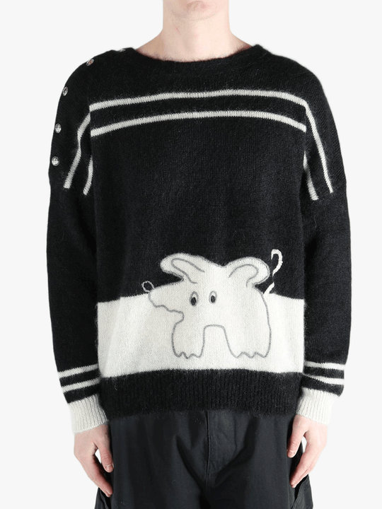 Black knitwear worn by a person, showing the cotton fit