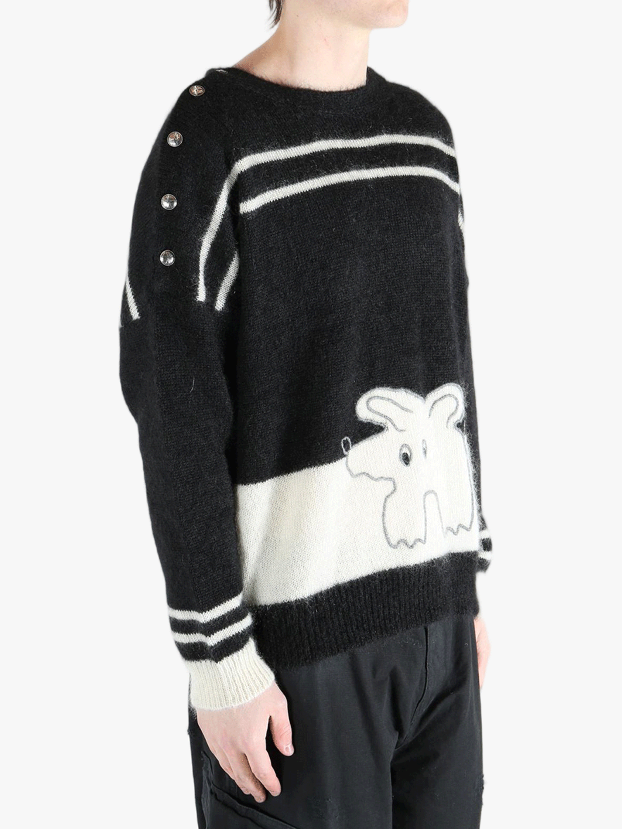 Black knitwear worn by a person, showing the cotton fit