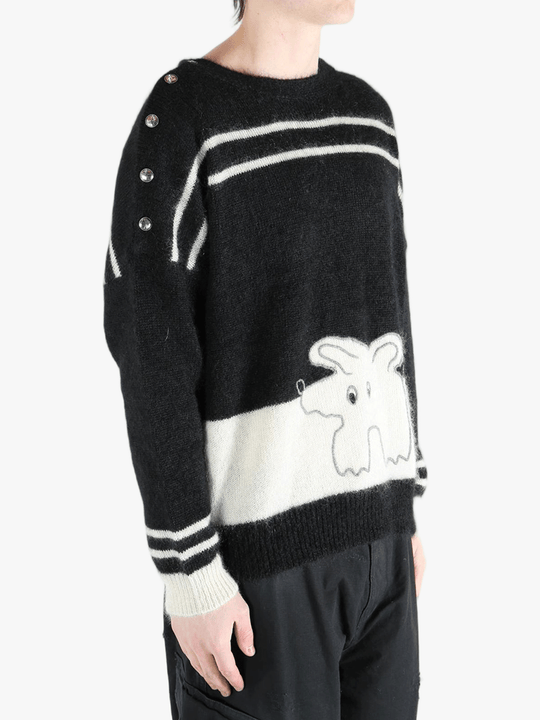 Black knitwear worn by a person, showing the cotton fit