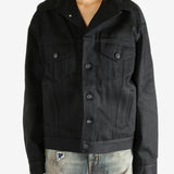 black jacket worn by a person, showing the jacket fit