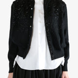 black Cardigan worn by a person, showing the Cardigan fit