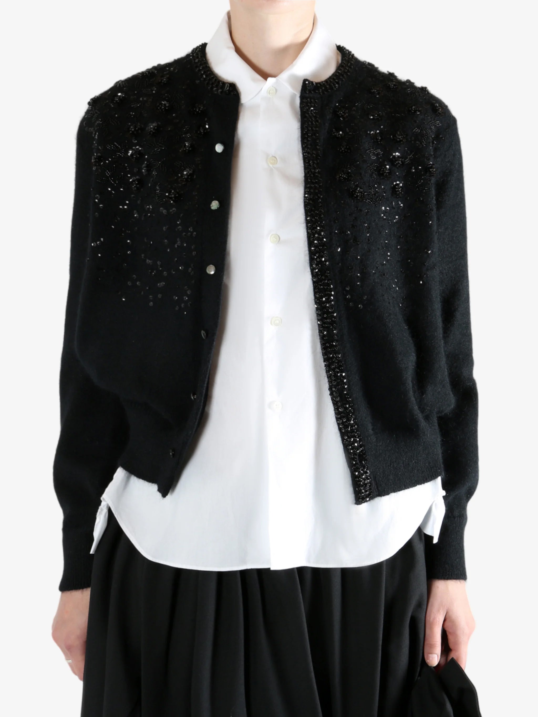 black Cardigan worn by a person, showing the Cardigan fit