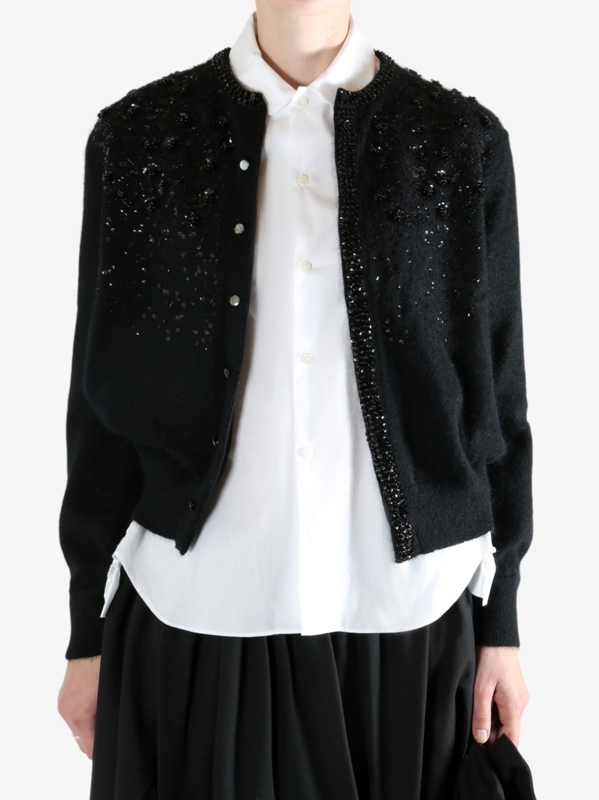 black Cardigan worn by a person, showing the Cardigan fit