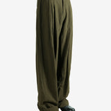 Green pants worn by a person, showing the pants fit