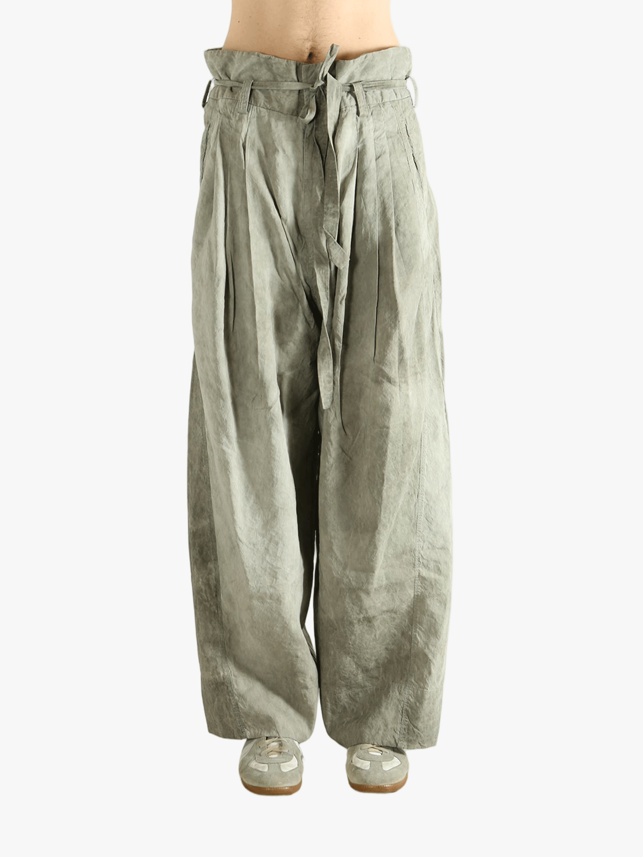 Light green wide-leg pants worn by a person, showing the pants fit