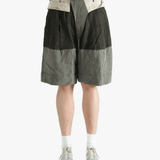 Black shorts worn by a person, showing the shorts's fit