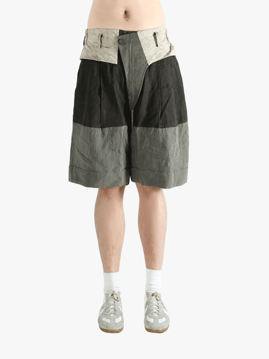Black shorts worn by a person, showing the shorts's fit