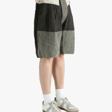 Black shorts worn by a person, showing the shorts's fit