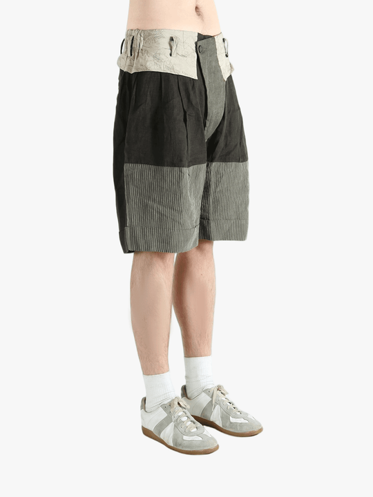 Black shorts worn by a person, showing the shorts's fit