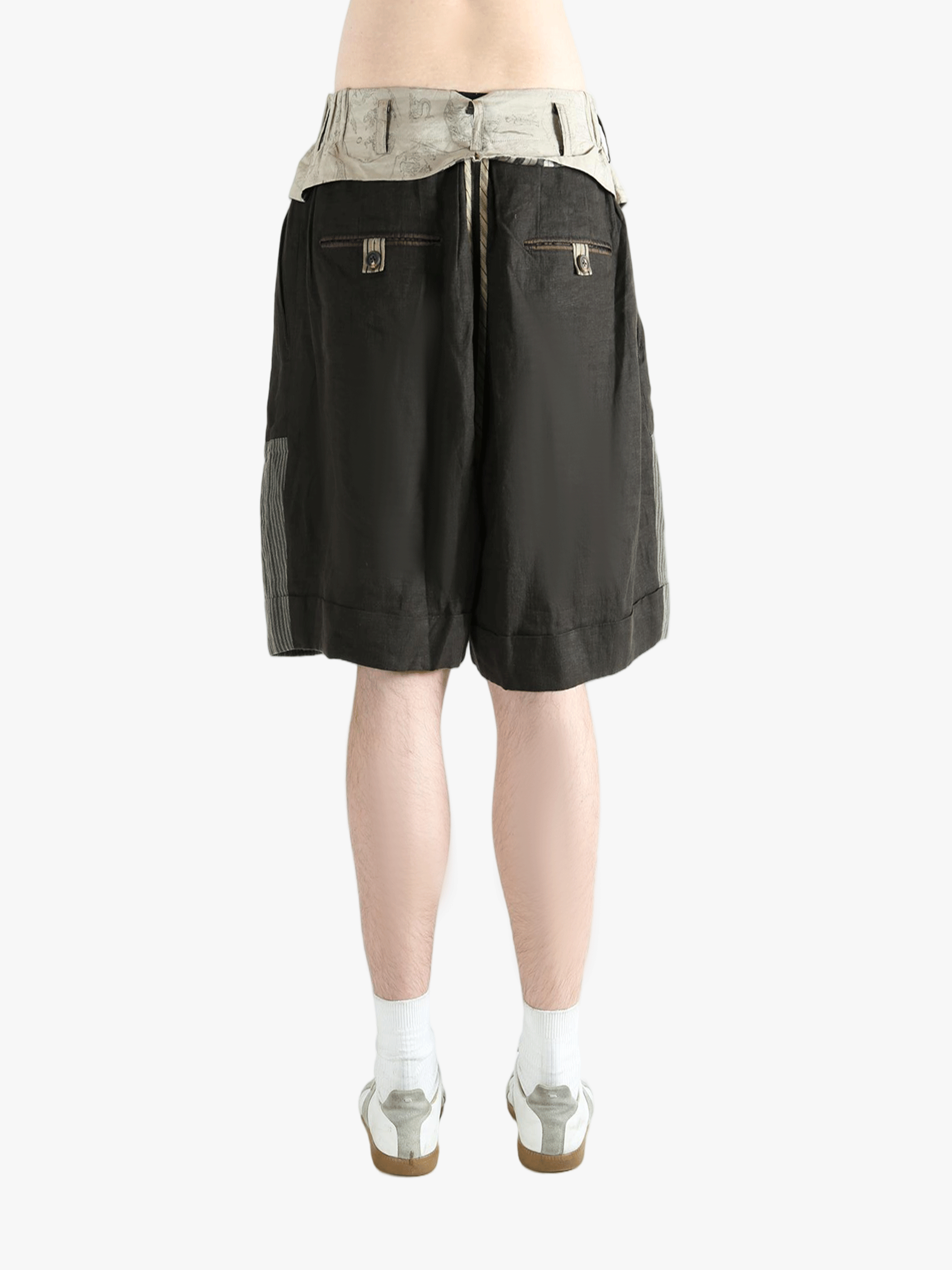 Black shorts worn by a person, showing the shorts's fit