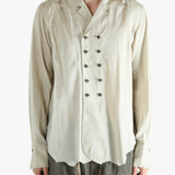 White shirt worn by a person, showing the shirt's fit