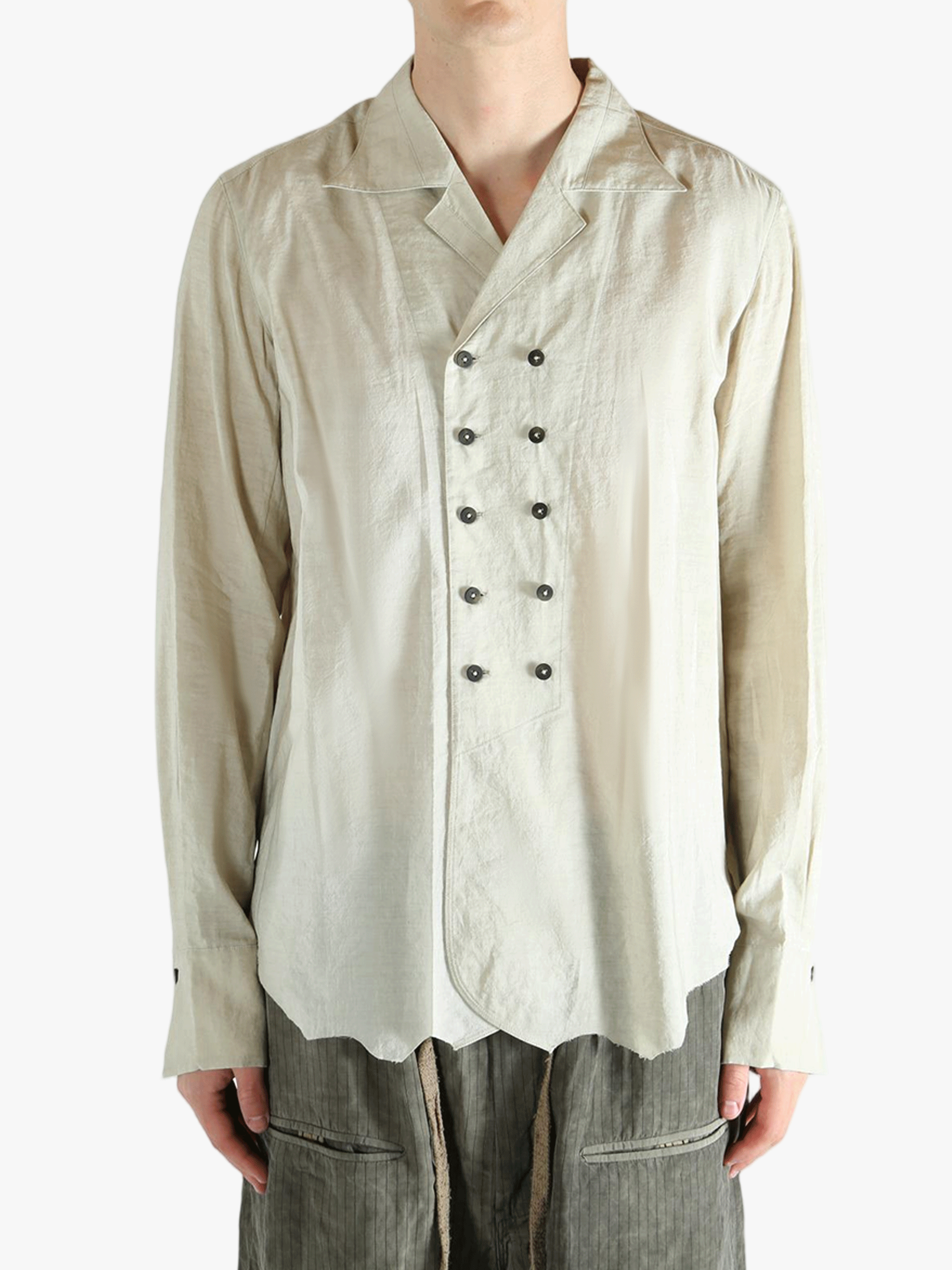 White shirt worn by a person, showing the shirt's fit