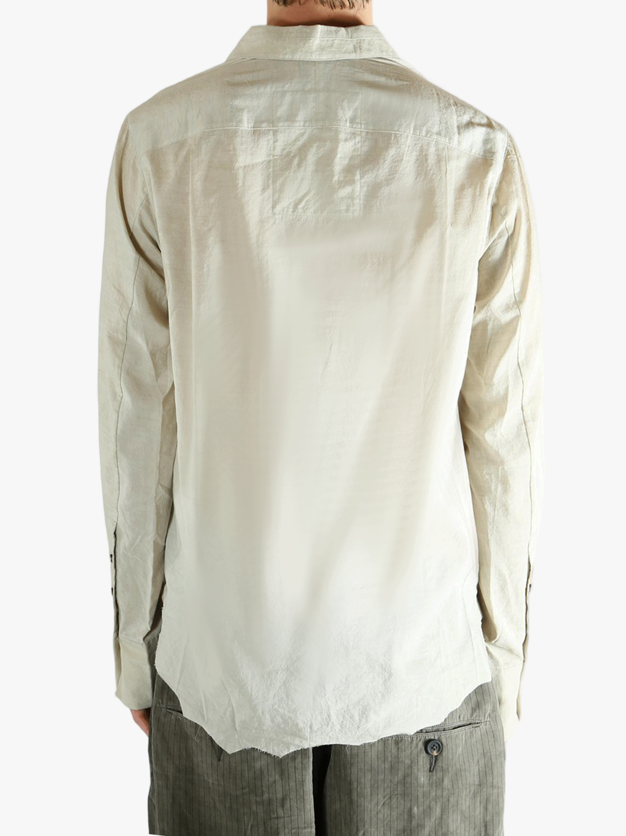 White shirt worn by a person, showing the shirt's fit