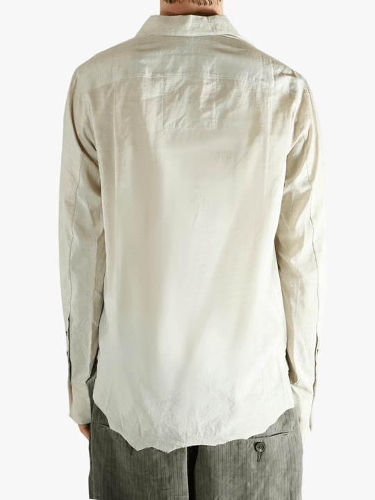 White shirt worn by a person, showing the shirt's fit